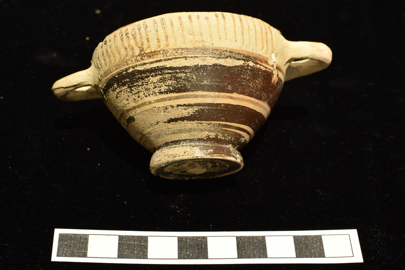 Miniature skyphos w handle zone decorated with pendant hooks on one side and vertical stripes on other, with alternating broad and narrow bands on body;   foot and interior totally coated.