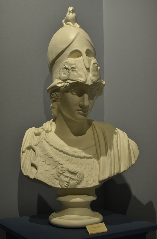 The helmeted Athena is a replica of a Roman copy of the so-called Giustiniani type of the 5th c. BC. The cast in the Wilcox Collection represents only the bust of a large statue in the Vatican Museums, Rome. The original sculpture was found in Rome on the Esquiline Hill in the 17th c. and belonged to the collection of Vincenzo Giustiniani in the Palazzo Giustiniani.
