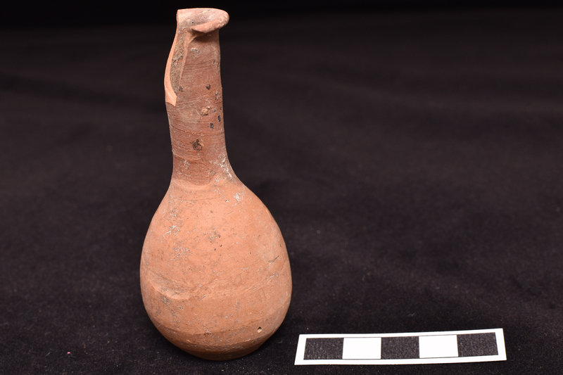 Bulbous body with tall cylindrical neck with out-turned rim, very sharply defined shallowly concave base.  Neck, rim and upper part of interior neck coated with dark matte paint.