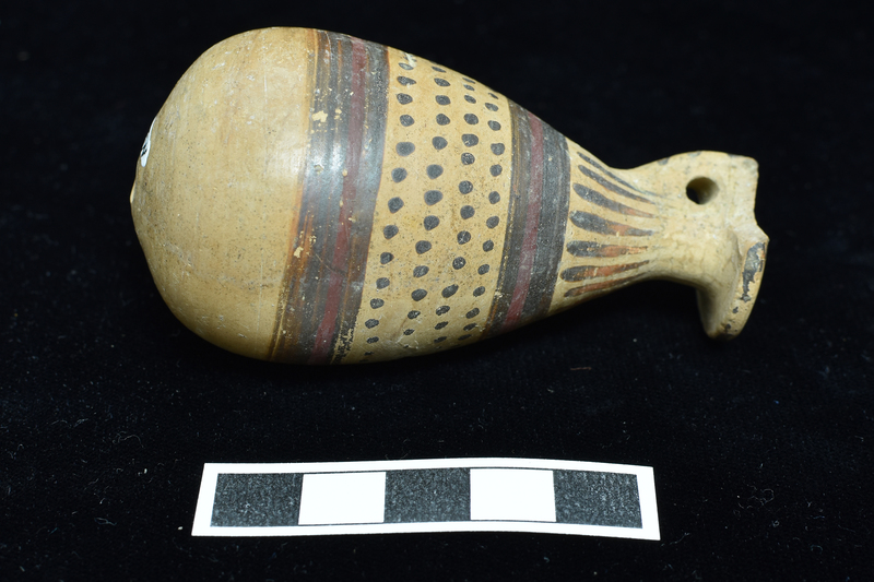 Small alabastron w main zone of four h rows of dots banded by broad stripe above and below  w  narrow red stripe  in center of each; pendant drops on shoulder;  rim solidly coated, diagonal stripes down back of handle.