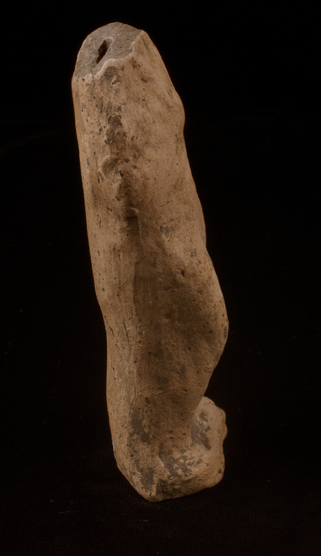 Mouldmade standing figure of Sophoclean type w r arm bent at elbow w hand resting at middle of chest, l arm at side holding folds of drapery which fall  down at l side of body; r leg bent at knee.  Low profiled base articulated only at front.