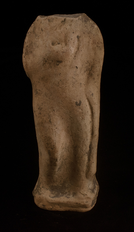 Mouldmade standing figure of Sophoclean type w r arm bent at elbow w hand resting at middle of chest, l arm at side holding folds of drapery which fall  down at l side of body; r leg bent at knee.  Low profiled base articulated only at front.