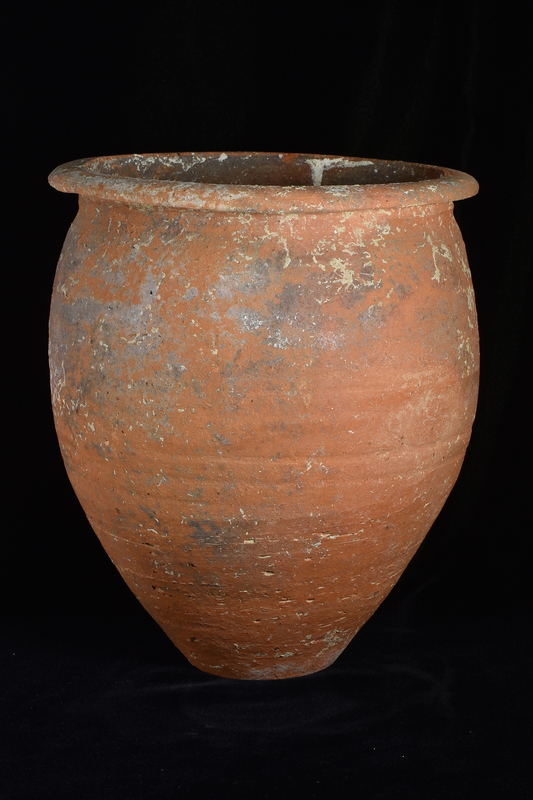 Large piniform jar with max D ca mid-height on flat base and outturned rim, of a type frequently used as a cremation burial urn.  Particularly prominent wheel marks on interior, more irregular on exterior which presumably smoothed.