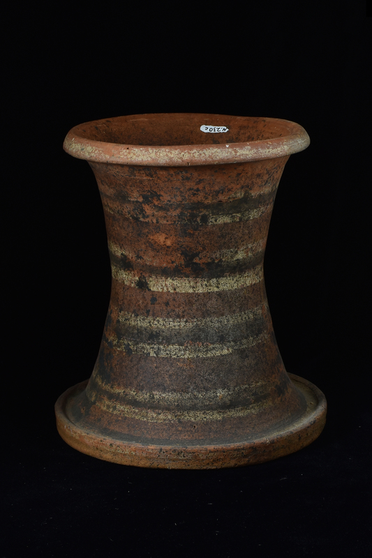 Three parts: A. lid, B. bowl, C. stand.  A. Discoid lid with slightly in-sloping sides coated all over in red paint and decorated on edges with white stripes around edges and on top surface with concentric black and white stripes.  B. Bulbous bowl with high maximum D with plain flat base and small offset rim.  Coated inside and out with red paint and decorated on shoulder with horizontal stripe from which suspended double festoons.  C. Tall asymmetrically concave cylindrical base with thick straight edged rim and low ring base exterior surface of which tapered inward toward body. Coated all over exterior and partway up interior from bottom with red paint.  Top and bottom edges decorated with white stripes and surface of base proper decorated with groups of black and white stripes.